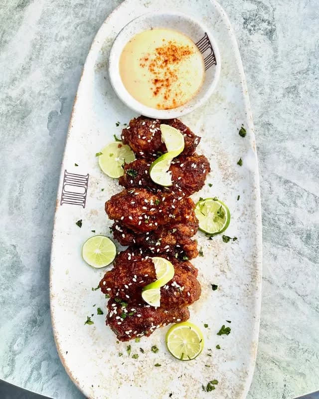 Glazed chicken served with lime at Paradis Lagos