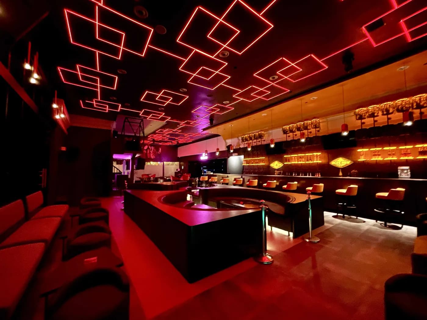 The lounge at Paradis Lagos under its neon-lit ceiling